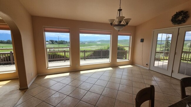 Building Photo - Out of town house with double garage and l...