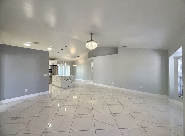 Building Photo - Stunning 3 Bedroom + Den Home with Fence + Screened Lanai in Great Location!