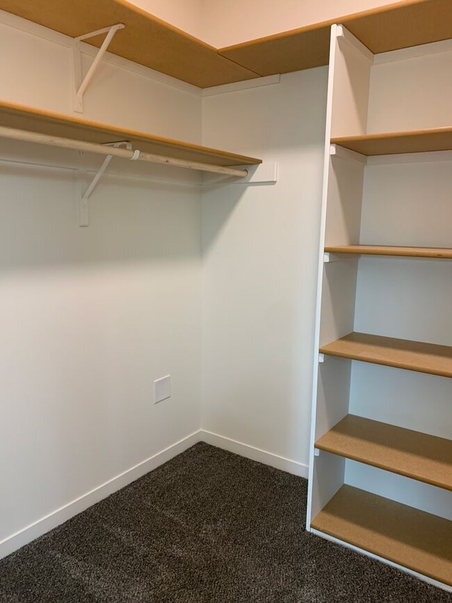 Building Photo - Walkout ranch townhome with 2 stall garage...