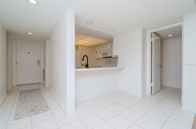 Kitchen and front door - 102 Mariner Dr