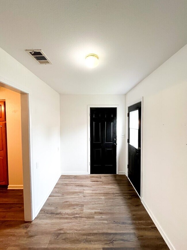 Building Photo - Available Now!!!! Gorgeous 3 bedroom, 2 bath, 2 car garage home. Beautiful wood look flooring. Sp...