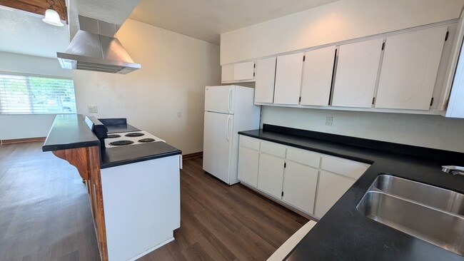 Building Photo - Darling Bungalow with New Flooring!