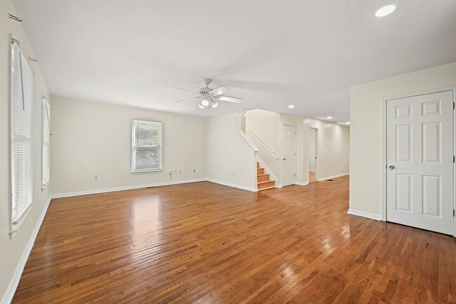 Another perspective of the spacious living room, highlighting its open layout - 247 Farrington Ave SE