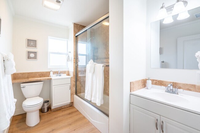 Building Photo - Enjoy stunning sunsets and beach living at its finest, Short Walk to Beach