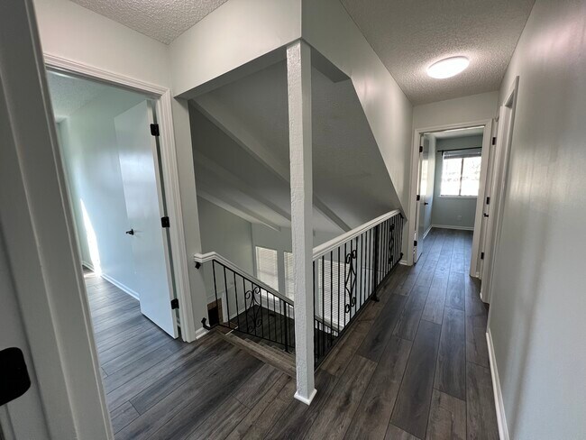 Upstairs hallway/entrance to small bedroom/far bedroom/2nd full bathroom - 14103 W 88th Terrace