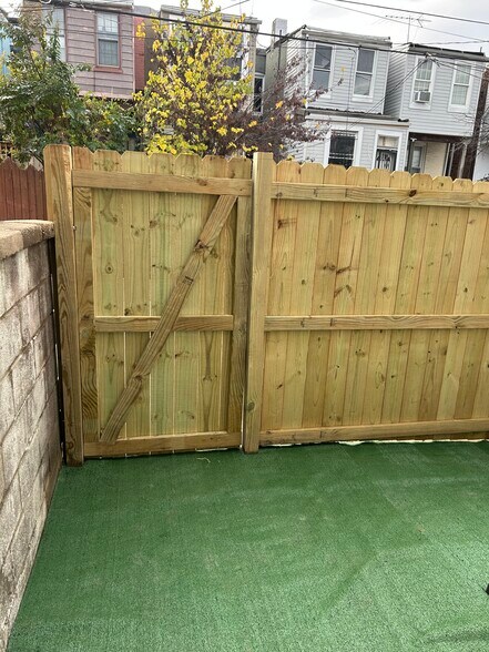 Back patio with privacy fence - 128 N Belnord Ave