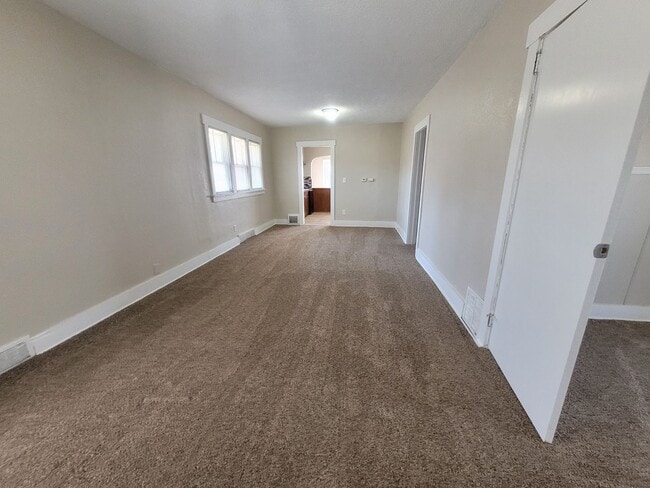 Building Photo - Four bedroom home on Indianola Ave with large yard and two decks!