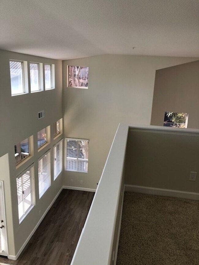 Building Photo - PICTURE PERFECT 2 BR/2 BATH PLUS LOFT END UNIT CONDO WITH DIRECT ACCESS 2 CAR GARAGE