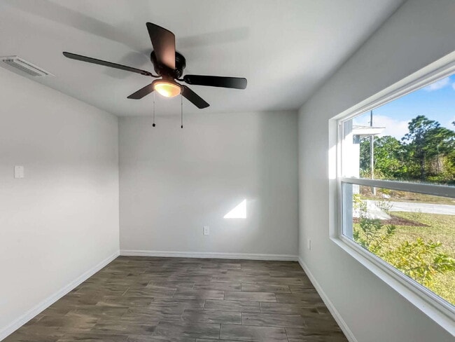 Building Photo - Move-In Special! Half Month FREE – APPLY by November 30th – Modern 3BR/2BA Duplex in Lehigh Acres...