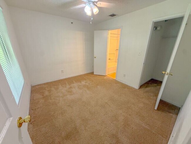 Building Photo - Top floor 4 bed 4 bath condo! On Wolfline, perfect for roommates!