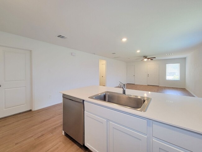 Building Photo - This single-story home has a comfortable layout with three bedrooms and a living area all on one ...