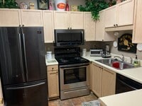 Kitchen W/ Black Stainless Steel Appliances - Bentley Place