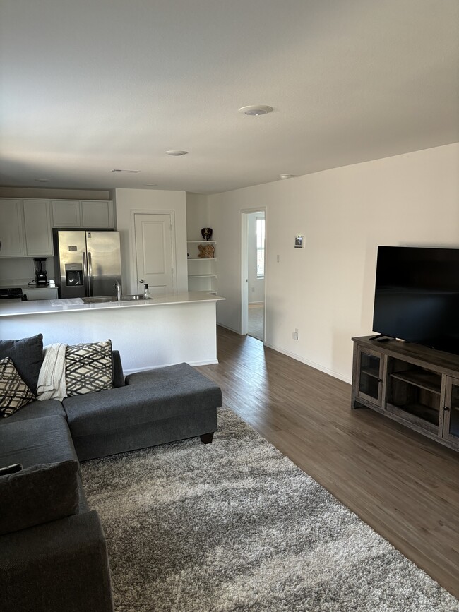 Living room looking into kitchen - 9130 Burnet Fields Dr