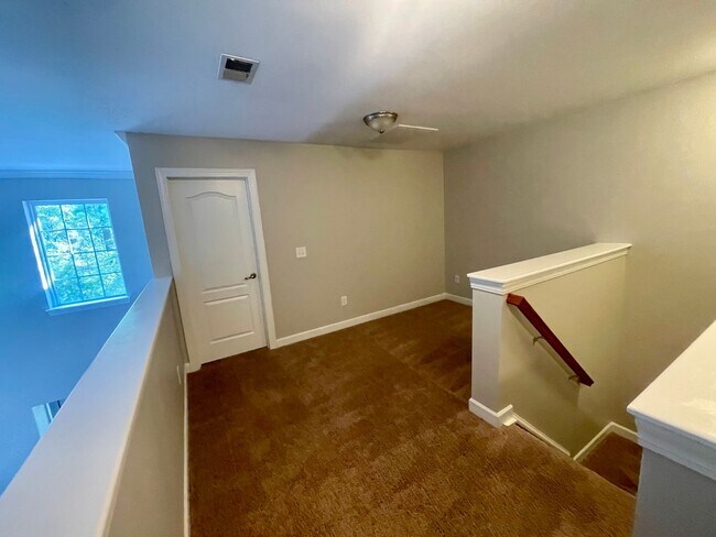 Building Photo - BRAND NEW FLOORING & FRESH PAINT - 3 Bedroom/2.5 Bath Townhome with garage in Wild Wing!
