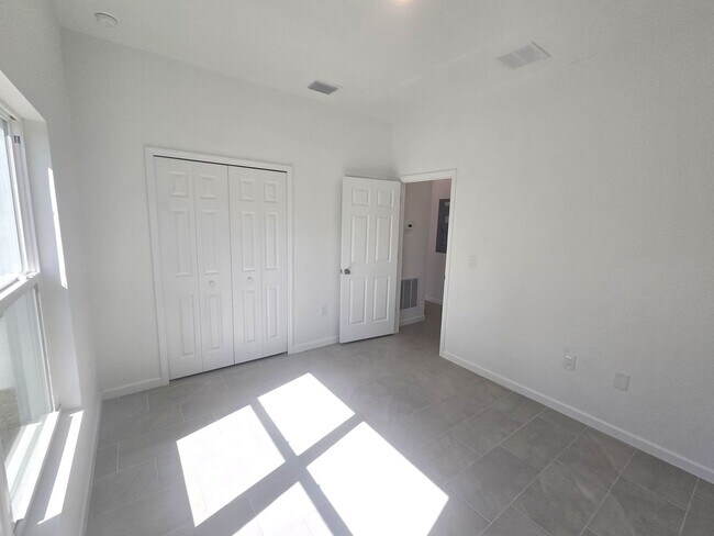 Building Photo - BRAND NEW-- TWO BEDROOM + TWO BATHROOMS- SOUTH LEHIGH ACRES