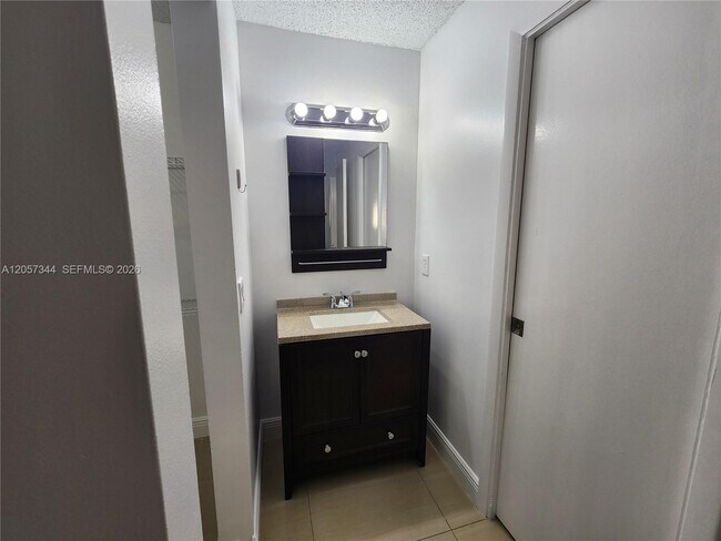 Building Photo - 9491 Palm Cir S