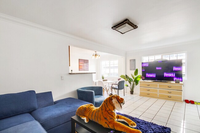 Relax in our light & airy living space, while streaming your favorite shows. - 2304 E 14th St