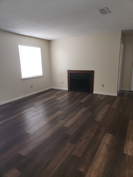 Living room w/Fireplace - 696 S 72nd Ave