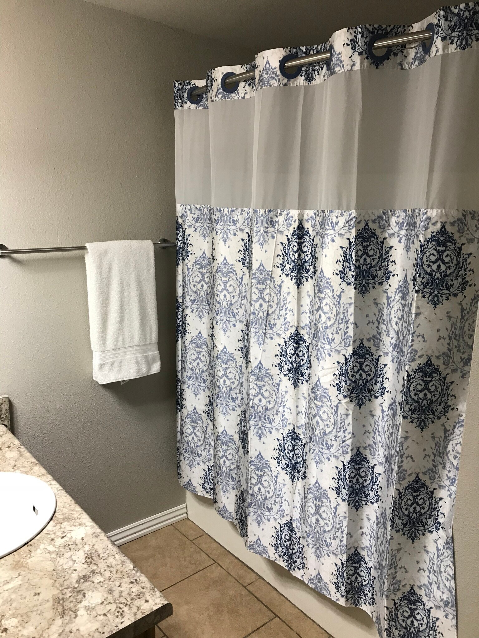 Hall bathroom - featuring hotel curtain rods for more shower space - 1382 N Dawn Dr