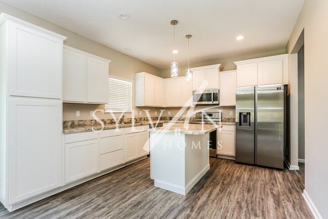 Building Photo - Turn the key. Enter. Smile. Repeat every day!