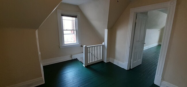 3rd floor at top of steps - 7718 Brashear St