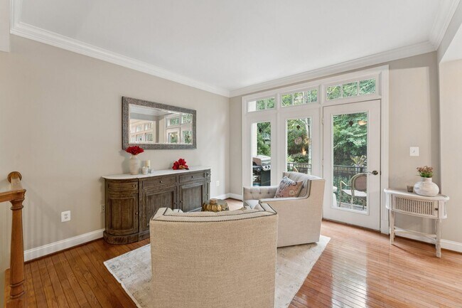 Building Photo - Discover this stunning four-level townhous...