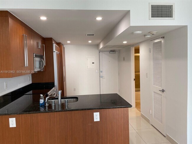 Building Photo - 10275 Collins Ave