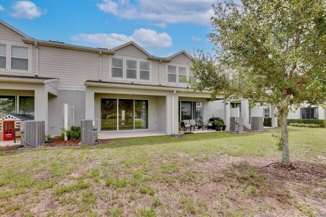 Building Photo - Immaculate Townhome · Dual En-Suite Bedrooms + Flex Loft · Cable & Internet Included · 3.5 Miles ...