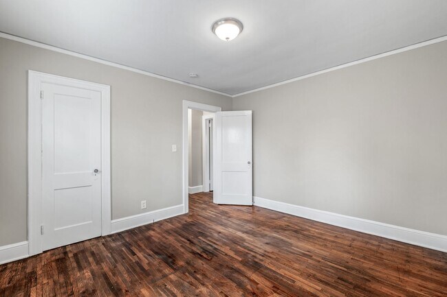 Building Photo - SW, Large Brick Two Bedroom PLUS Two Sun-Rooms, Hardwoods, LR & Separate DR, Fire Place!