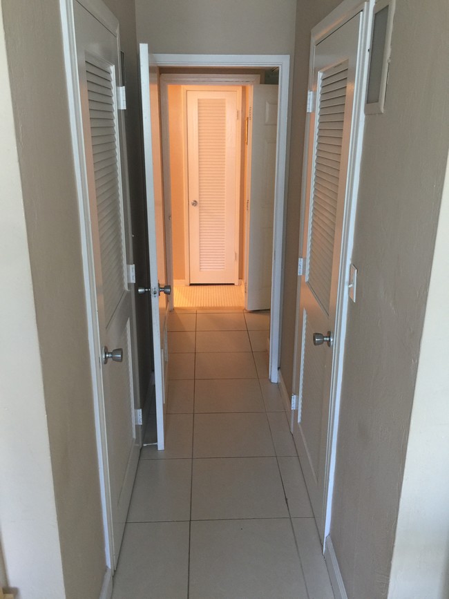 hallway from the bedroom w/2 walk-in closets - 19390 Collins Ave