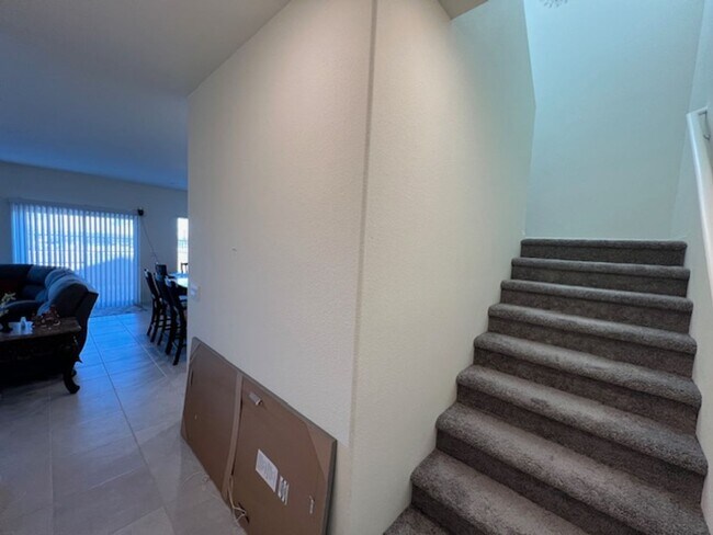 Building Photo - FULLY FURNISHED!!! beautiful 3 bedroom 2 and half bath home is located in the Symmetry Bay Cadenc...