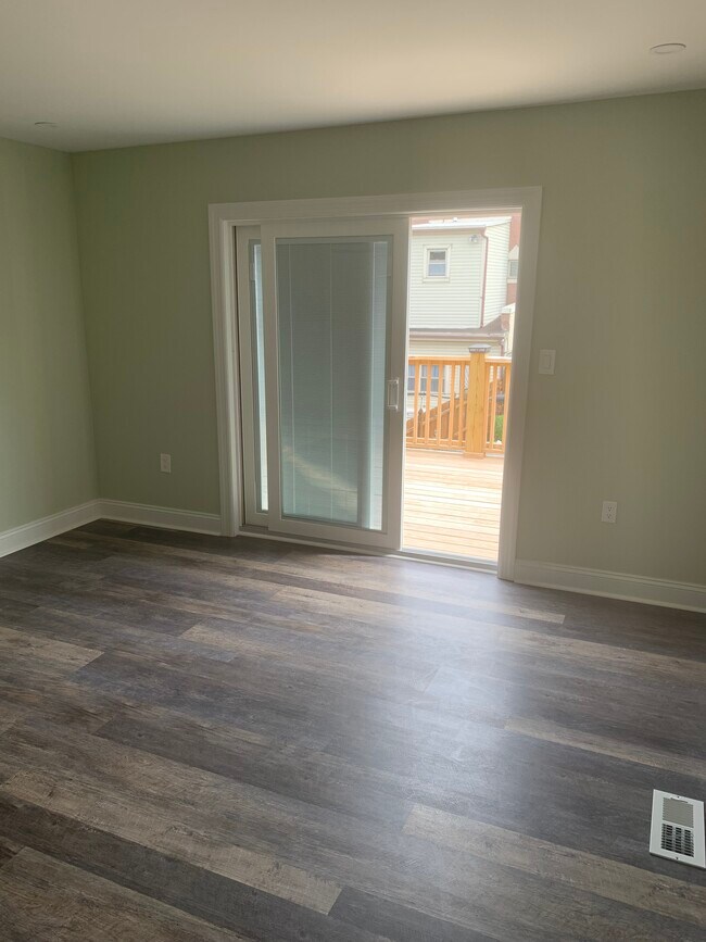 Large rear bedroom with deck - 1815 E Hazzard St