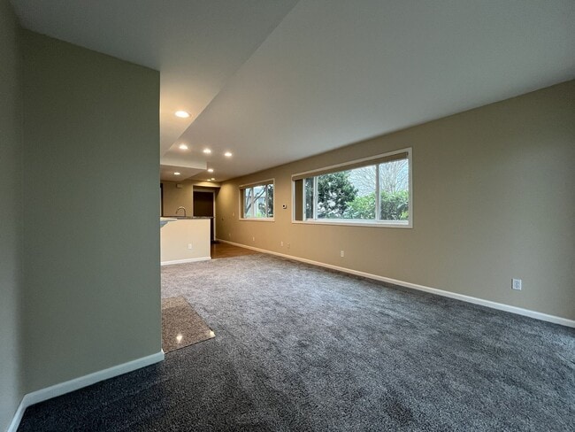 Building Photo - Ground Floor End Unit on Jantzen Beach with River Views & Flexible Living Space