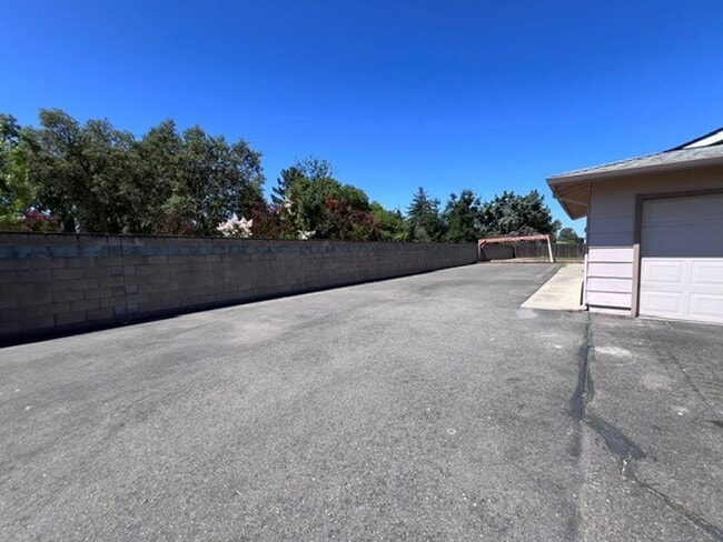 Building Photo - Freshly painted 4 bedroom home on over 2 acres of land.