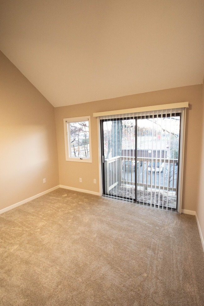 Second Bedroom with high slanted ceiling & sliding doors to Private Deck - 115 Beechnut St