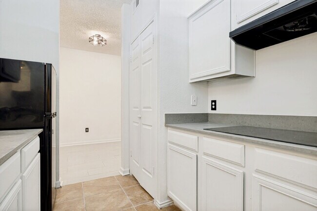 Building Photo - Spacious Dallas Condo with Unbeatable Storage, Private Patio & Carport