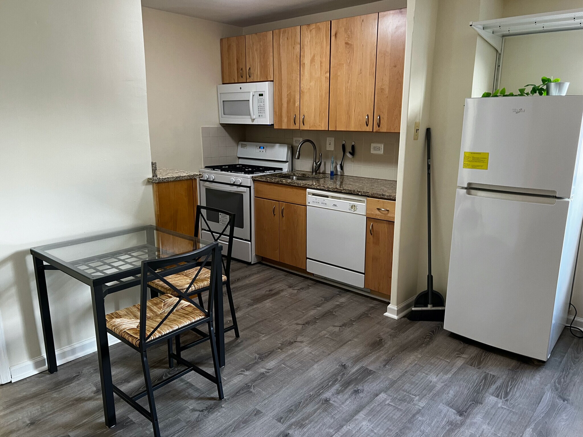 kitchen with fridge, microwave, dishwasher, gas range, granite counters - 1420 N St NW