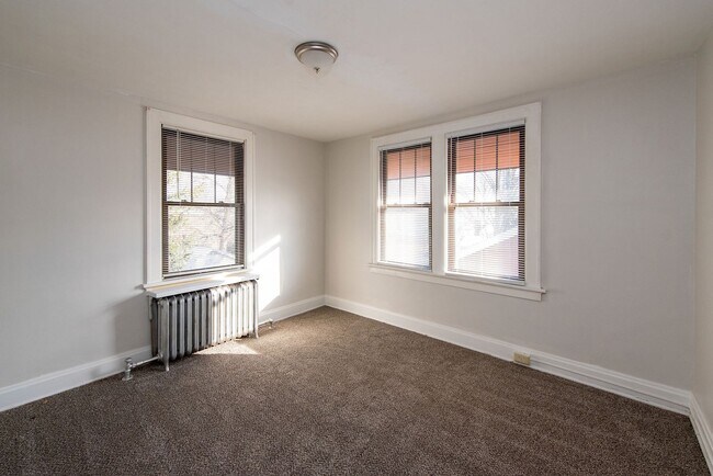 Building Photo - Beautifully updated Tudor style duplex. Up...
