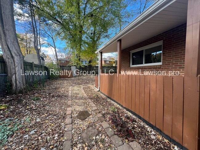 Building Photo - Charming Brick Ranch with Beautifully Landscaped Yard and Attached Carport