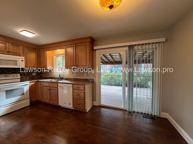 Building Photo - Charming Brick Ranch with Beautifully Landscaped Yard and Attached Carport