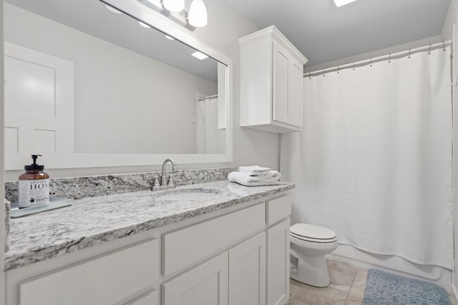 Building Photo - Stunner! This beautiful home features a spacious open floor plan with primary suite and private o...