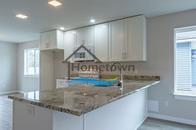 Building Photo - 3 Bedroom Home with 1.5 Bathrooms and an A...