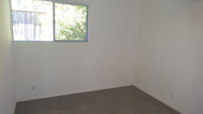 Building Photo - BEAUTIFUL UPDATED FOUR BED / TWO BATH PLUS OFFICE EICHLER HOME WITH GREAT OUTDOOR SPACE