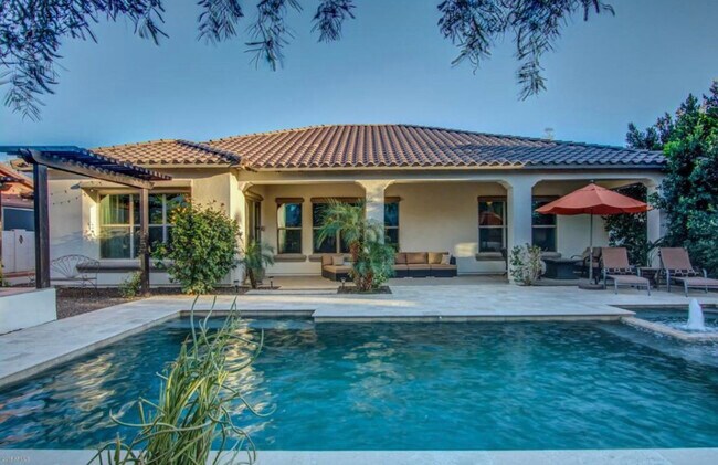 Extended cover patio overlook a gorgeous salt water pool with Travertine surround - 20892 W Eastview Way
