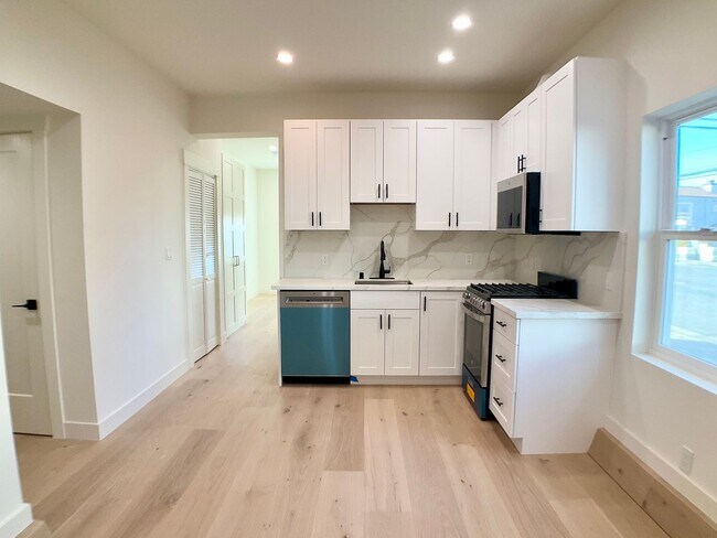 Building Photo - Lowered Price! FULLY Remodeled. BRIGHT! In-Unit W/D, Stainless Appliance Package, MODERN!
