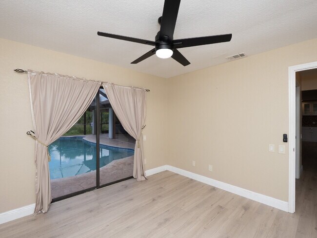 Building Photo - 3 BEDROOM • 2 BATHROOM • PRIVATE POOL • WATERFRONT • BOAT LIFT • ZERO DEPOSIT MOVE-IN AVAILABLE
