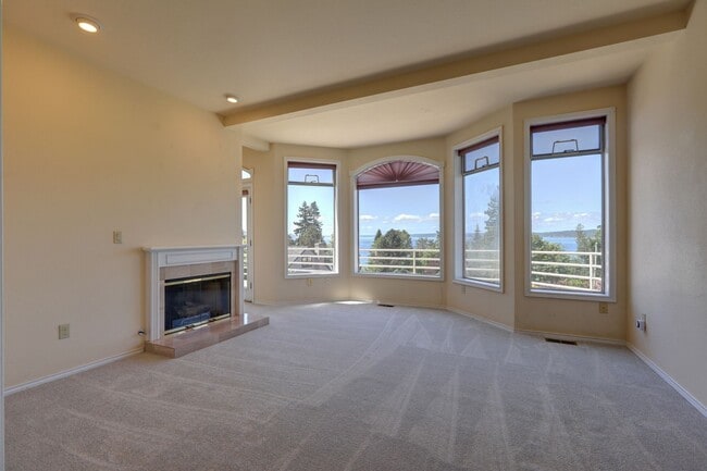 Building Photo - 4+ Bedroom with Great Entertaining Wrap Around Decks with VIEW of PUGET SOUND!!