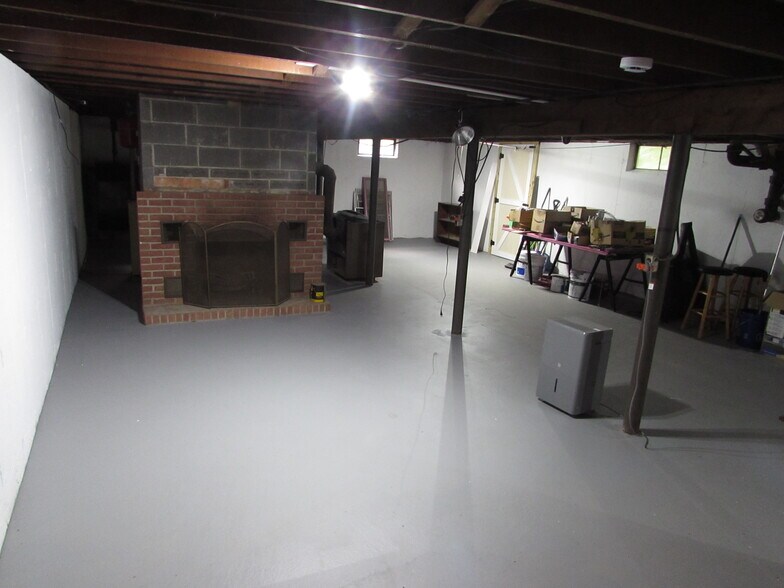 Basement with fireplace #2 as viewed from bottom of stairs - 97 Scrub Oak Rd