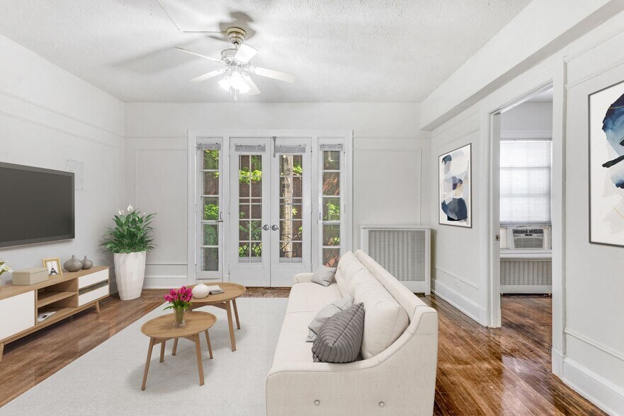 One-bedroom apartment living area (virtually staged) - Highview and Castle Manor
