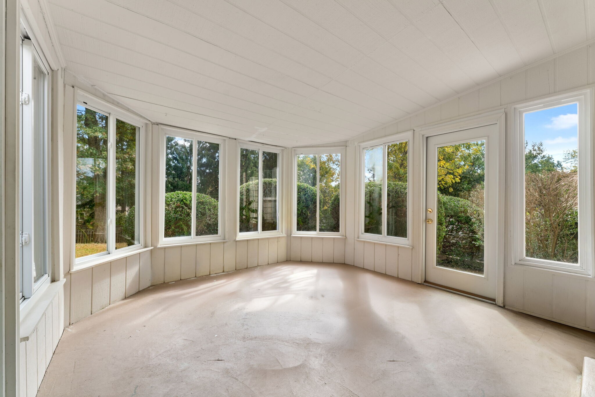 Chaming solarium with stunning views from every window of rear yard! - 9 Snug Hill Ct